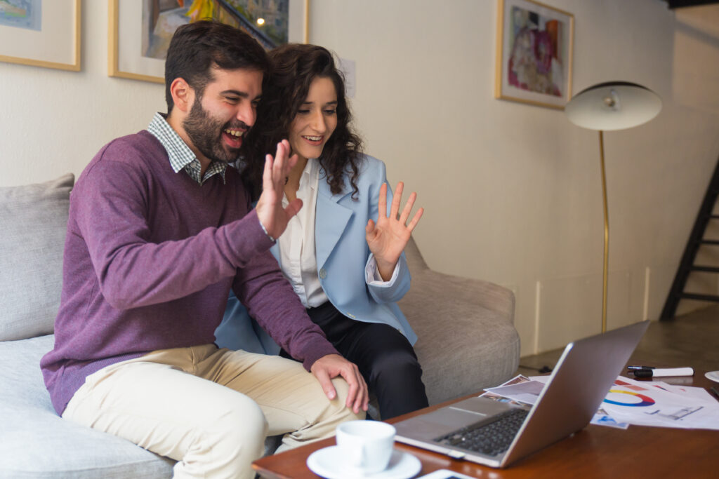 couple having an online therapy session with a therapist on laptop