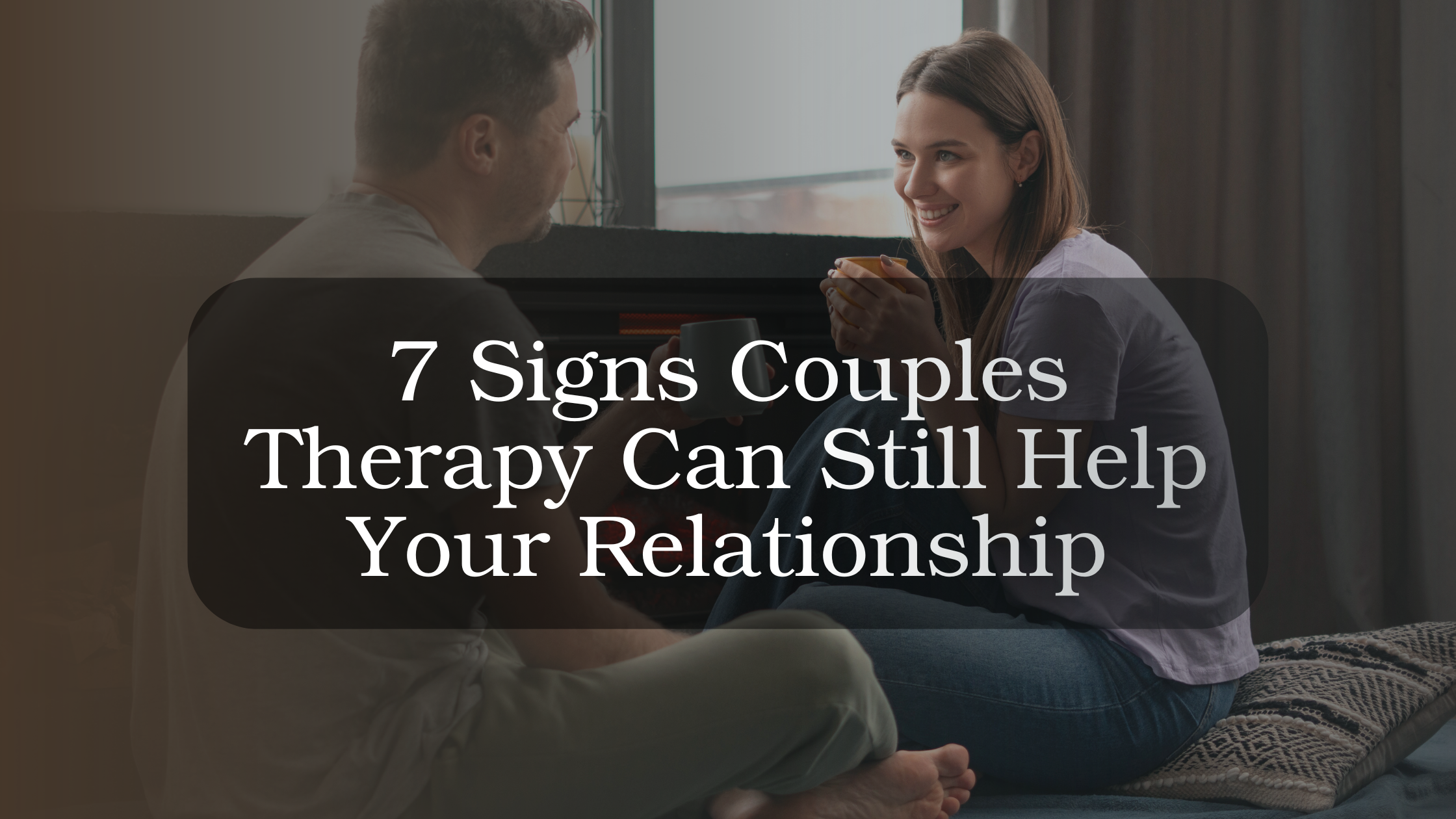 Couple sitting together in a therapy session with a counselor, representing signs that couples therapy can help improve a struggling relationship
