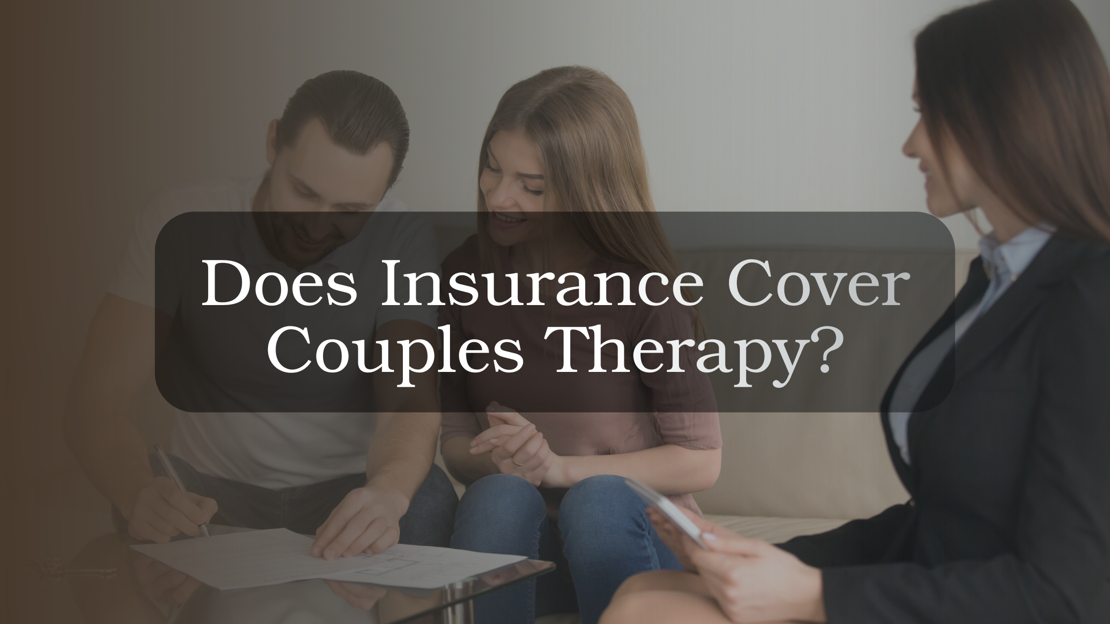 Couple reviewing insurance documents with therapist, representing questions about whether couples therapy is covered by insurance