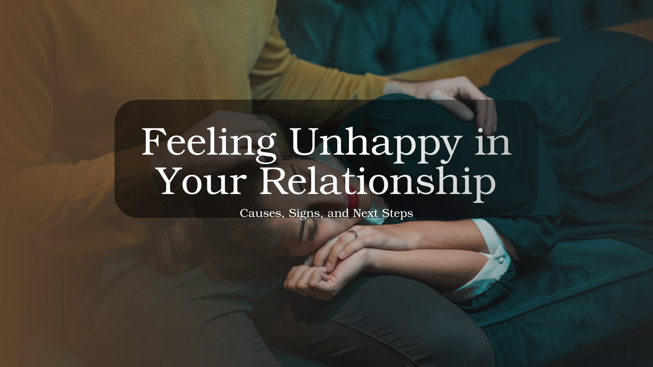 Couple sitting apart looking distant and unhappy, representing emotional disconnection and signs of dissatisfaction in a relationship