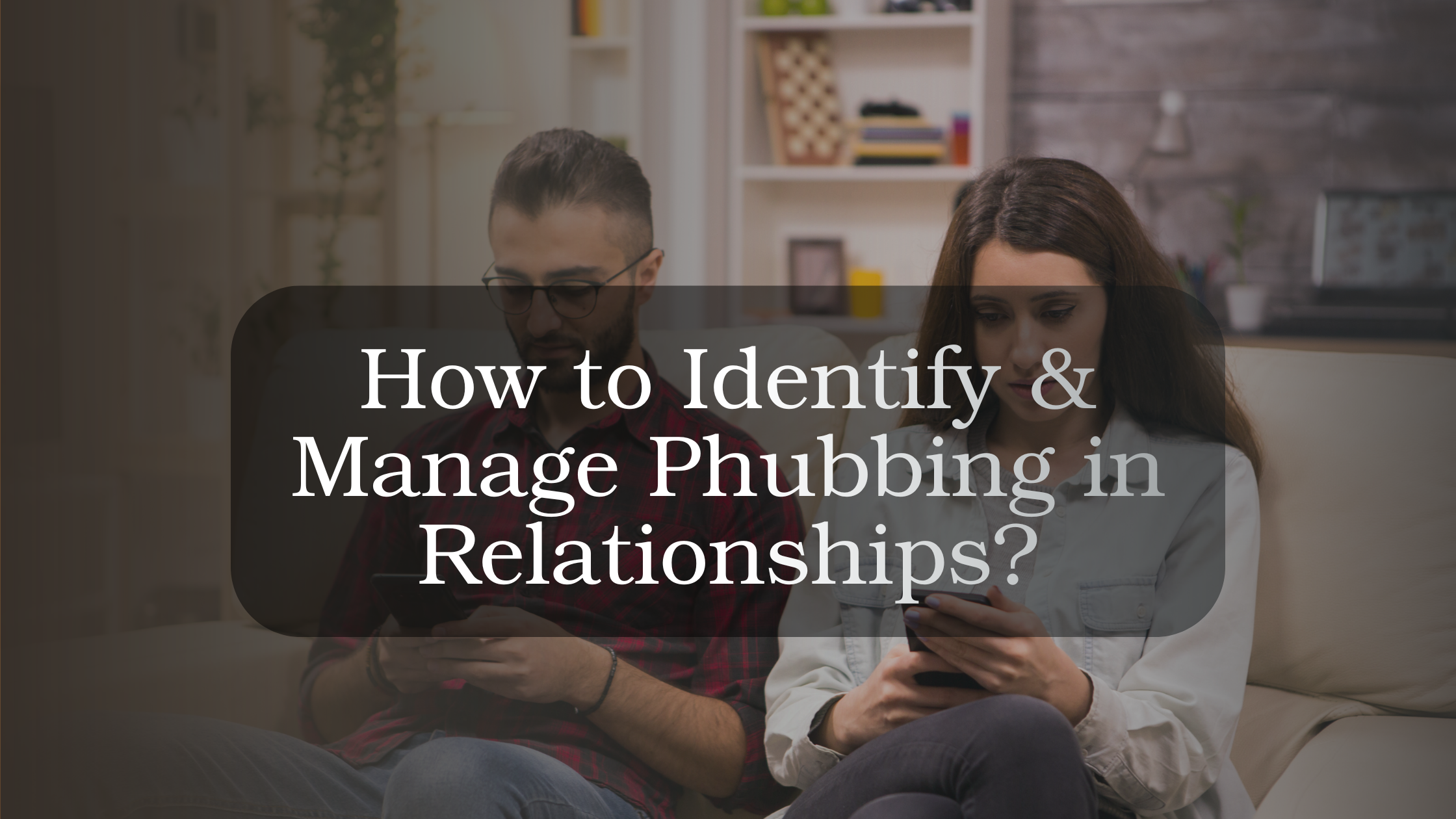 Couple sitting together while one partner is distracted by their phone, illustrating phubbing and its impact on connection in relationships