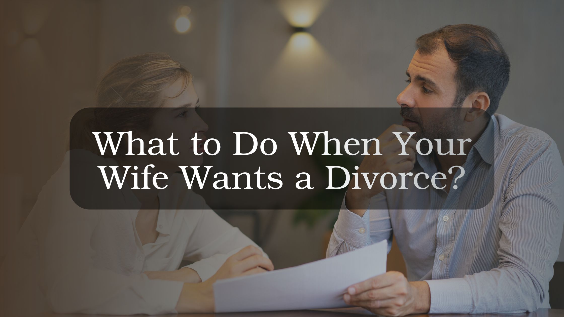 Couple sitting apart in emotional distance discussing divorce, representing relationship distress and guidance on what to do when a wife wants a divorce