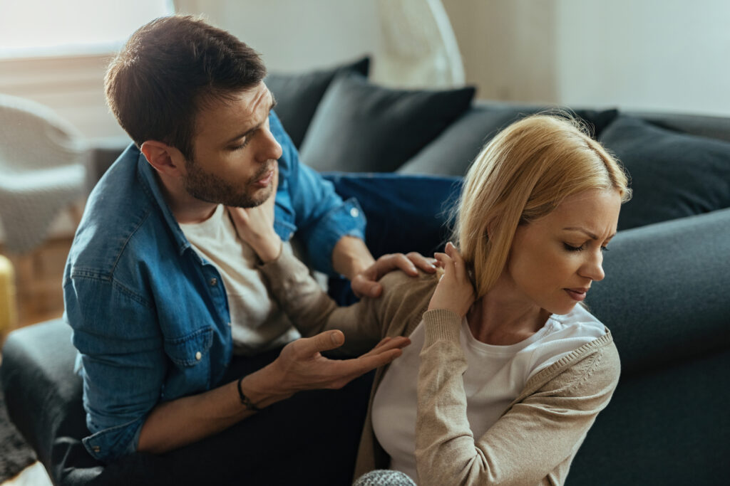 Couple struggling with emotional disconnection and defensiveness during a relationship conflict.