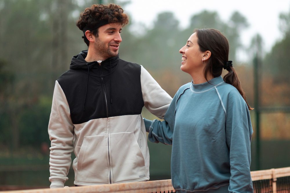 Couple sharing a calm and supportive moment outdoors, illustrating emotional regulation, healthy communication, mutual understanding, and emotional connection in a strong relationship.