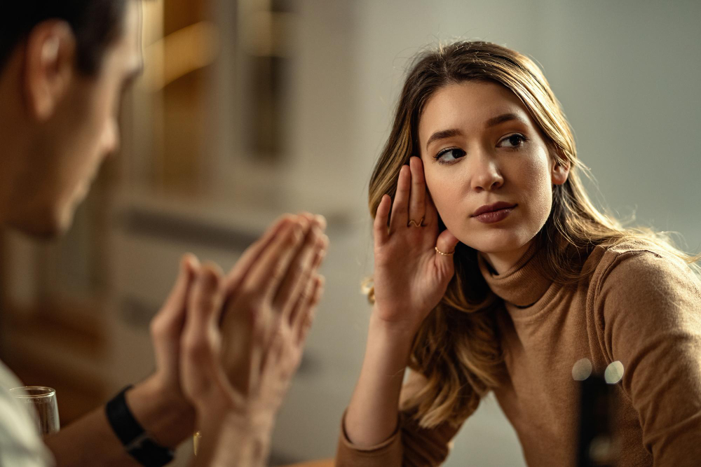 Partner listening attentively during a respectful relationship conversation, demonstrating active listening and healthy communication in couples therapy.