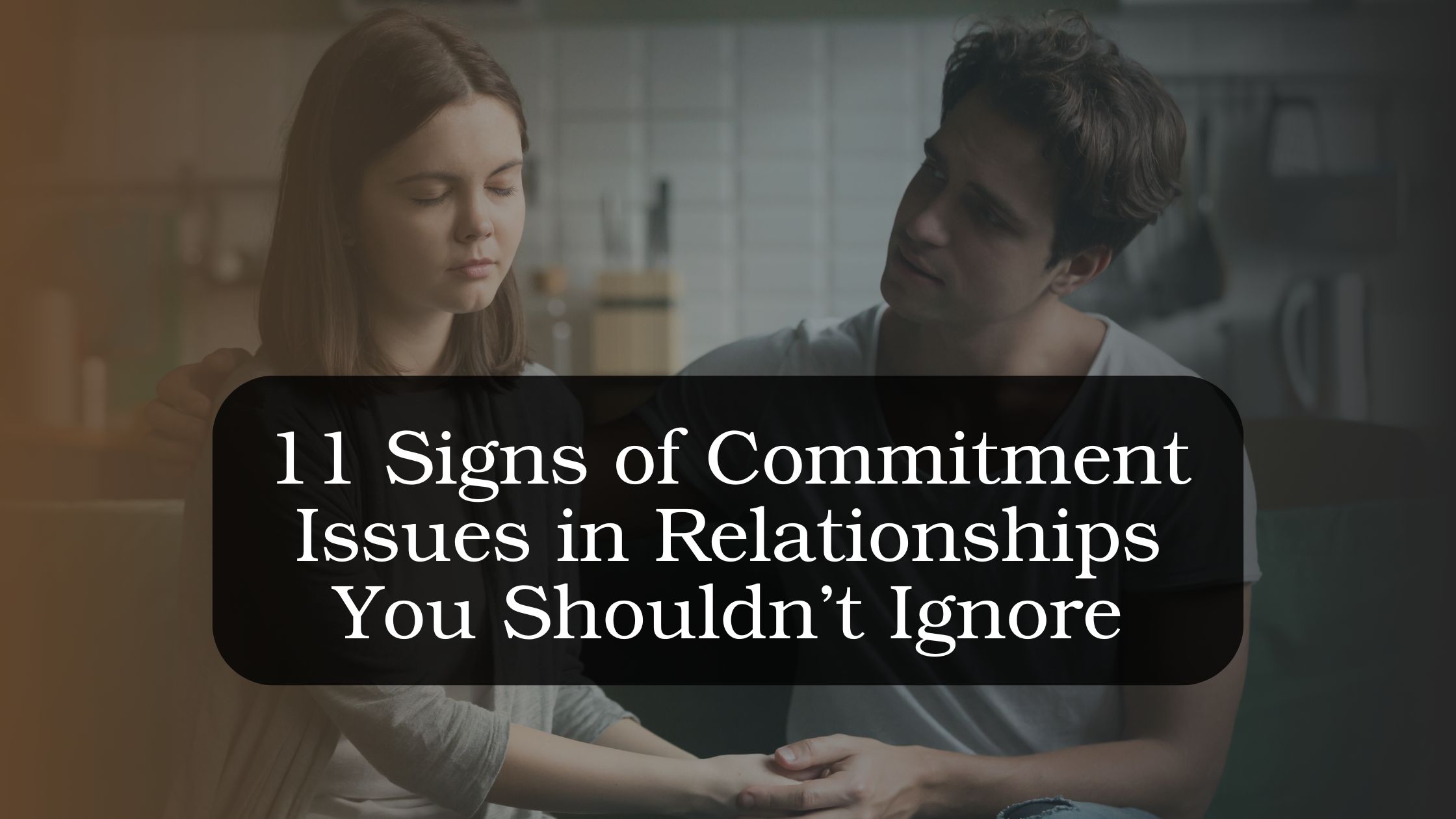 Couple sitting apart while reflecting on signs of commitment issues in relationships and emotional distance affecting long-term commitment